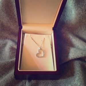 14kt white gold and diamond heart necklace.